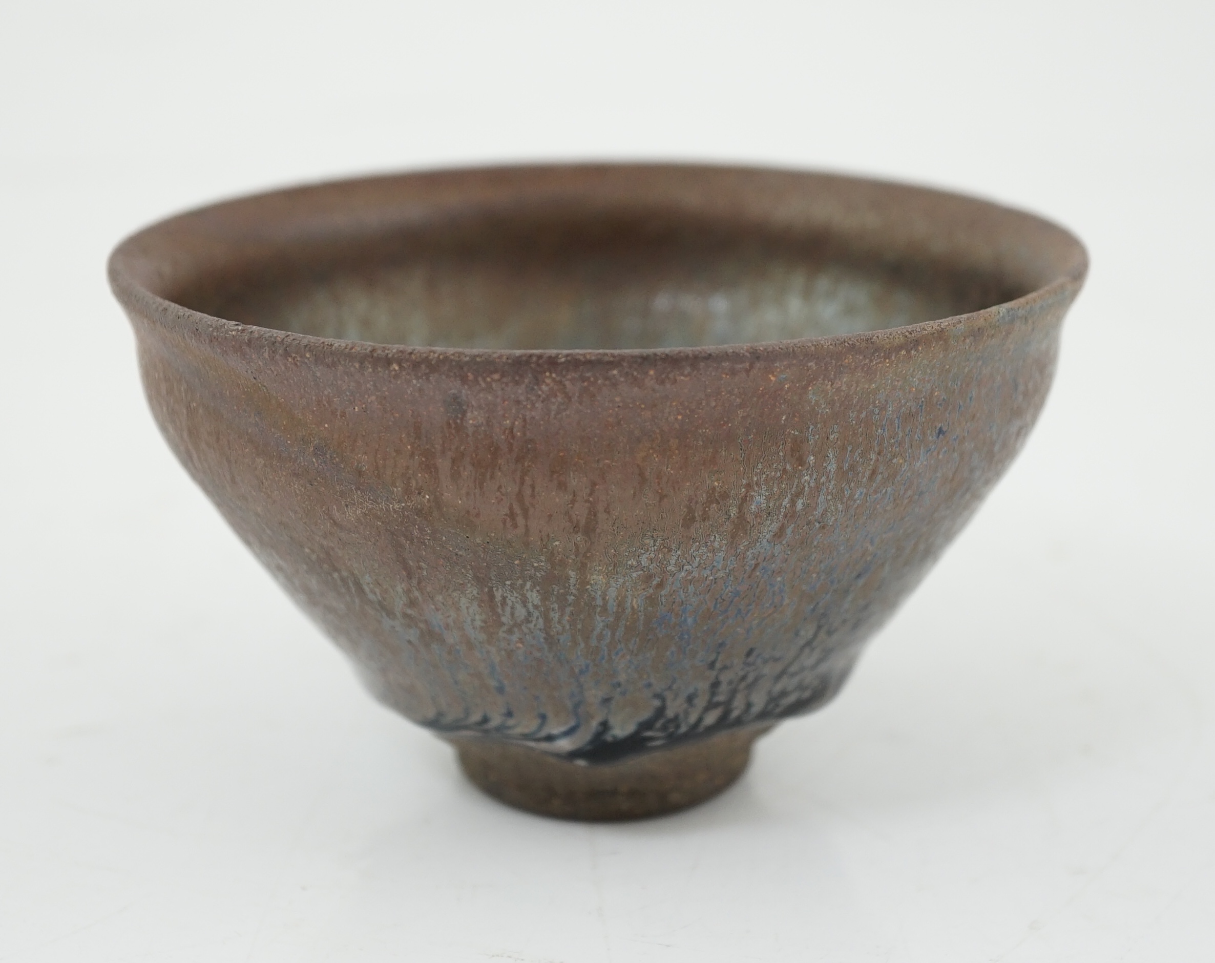 A Chinese 'hares fur' pottery bowl, Song Dynasty with a thick glaze pooling above the unglazed base, 12.2cm diameter. Provenance - Robert Ricketts collection. Condition - good